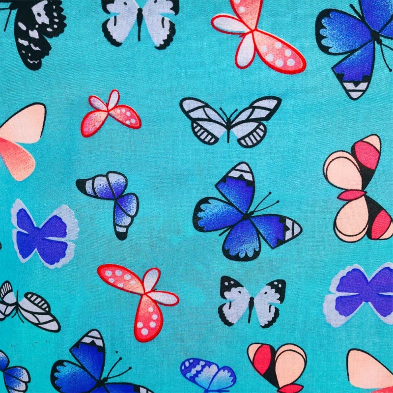Tissu Viscose imprimée de papillons multicolores sur un fond bleu turquoise. Tissu Viscose imprimée de papillons multicolores sur un fond bleu turquoise.
